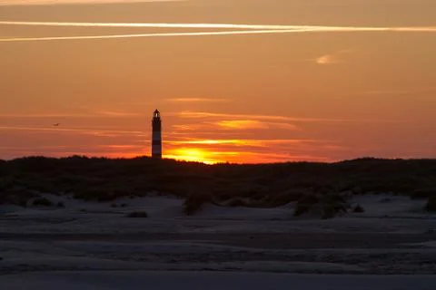 Sunset behind lighthouse Stock Photos