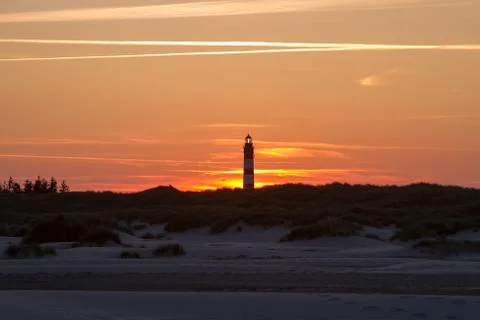Sunset behind lighthouse Stock Photos