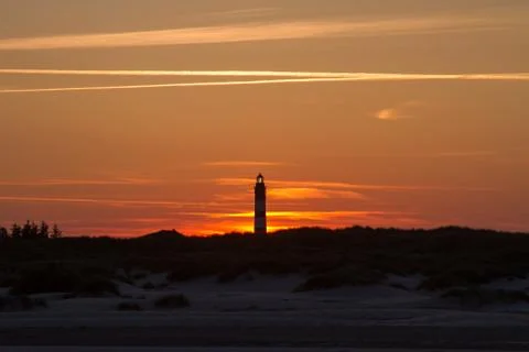 Sunset behind lighthouse Stock Photos
