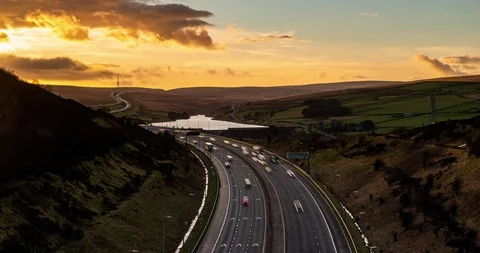 Sunset behind a motorway Stock Footage 124416145