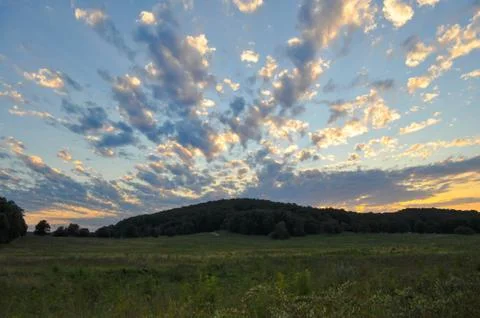 Sunset Behind a Mountain Landscape Fotos Stock