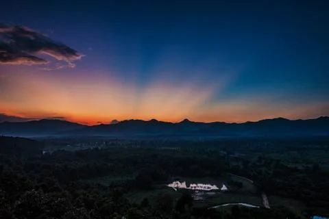 Sunset behind mountain. Stock Photos