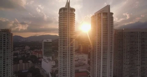 Sunset Behind Mountains and Luxury Condominiums  at Gurney Drive, Penang, Video stock 78958587