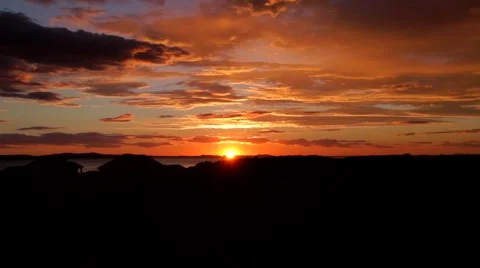Sunset Behind Mountains And Orange Clouds Stock Footage 68102308