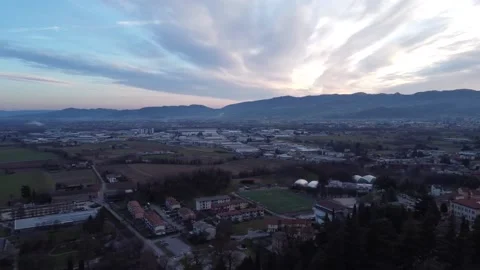 Sunset behind the mountains in the distance above the city. Stock Footage 168187355