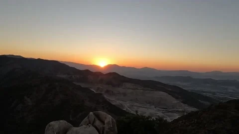 Sunset behind the mountains in the evening Video stock 219881628