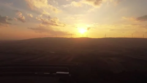Sunset Behind Mountains with Golden Sky and Farmlands – 4K Drone Footage Stock Footage 320198160