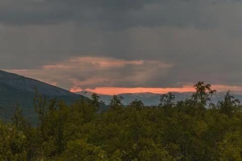 Sunset behind mountains Foto stock