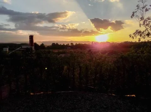 Sunset behind the mountains Stock Photos