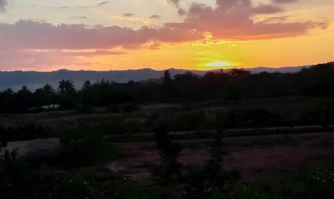 Sunset behind the mountains Stock Photos