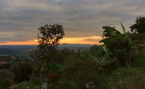 Sunset behind the mountains Stock Photos