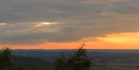 Sunset behind the mountains Stock Photos
