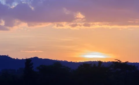 Sunset behind the mountains Stock Photos