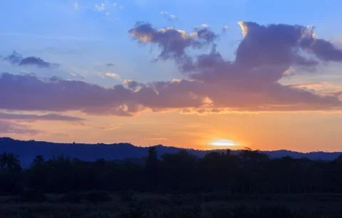 Sunset behind the mountains Stock Photos