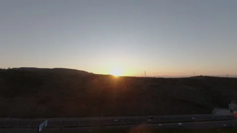 Sunset from behind the mountains timelapse Stock Footage 144976512