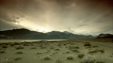 Sunset Behind Mountaintops, Death Valley, California Pan HD Video Stock Footage 22774827