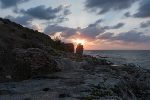 Sunset behind Phonecian wall Stockbeeldmateriaal 163956871