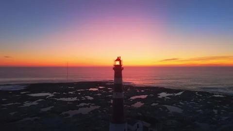 Sunset Behind Red Lighthouse on Frøya Island, Norway Stock Footage 317318005