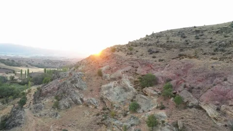 Sunset behind rocky mountains Stock Footage 144976507
