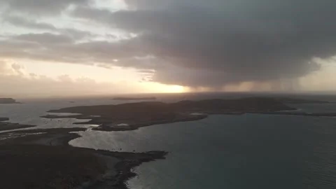Sunset behind single raincloud in Scottish Islands 4K Stock Footage 299326915