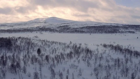 Sunset behind snowy mountain Stock Footage 73043706