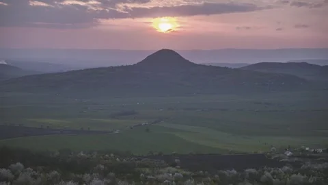 "Sunset Behind Symmetrical Hill – Timelapse" 4K Stock Footage 316315990