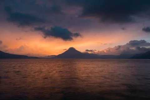 Sunset behind Volcan San Pedro on Lake Atitlan Stock Photos