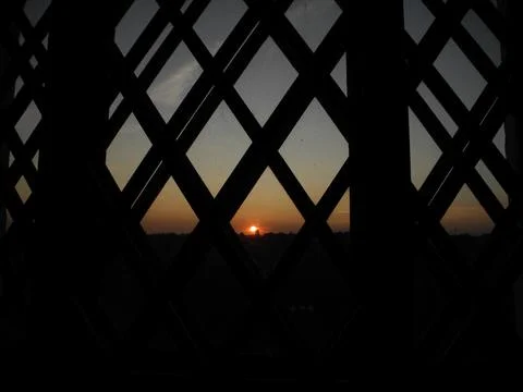 Sunset behind window Stock-Fotos