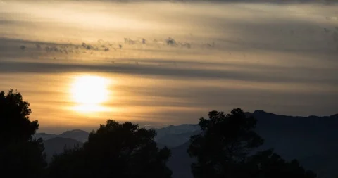 Sunset behinde the mountains with red sky (timelapse) Stock Footage 129477935