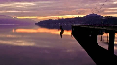 Sunset Beside Boat Dock on Mountain Lake Stock Footage 11164587