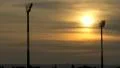 Sunset between Floodlights at Sports Field HD Footage