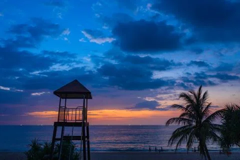 Sunset between guard tower and coconut tree Fotos de archivo