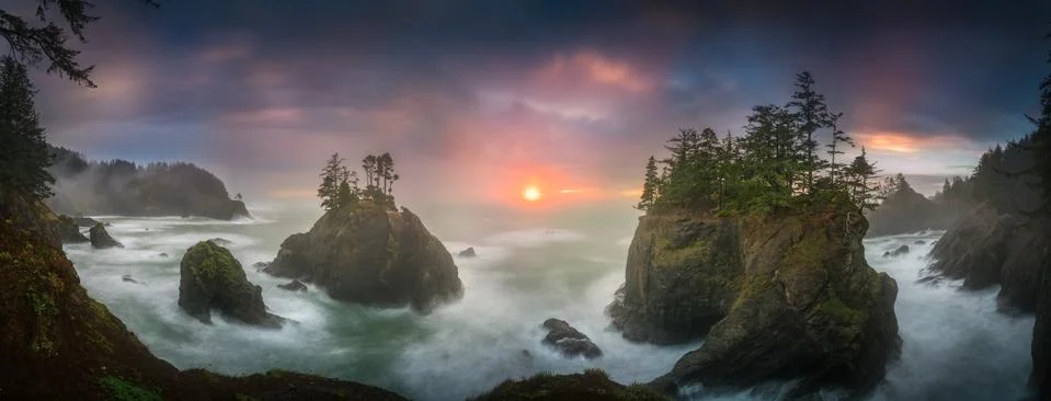 Sunset between Sea stacks with trees of Oregon coast Stock Photos
