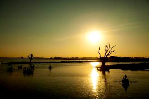 Sunset beyond the lake Stock Photos