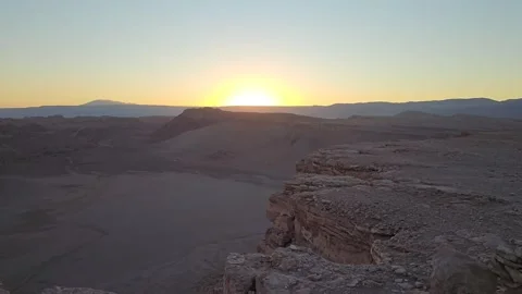 Sunset beyond Rock Ledge in Valle de la Luna, San Pedro de Atacama, Chile 8K Stock Footage 331534586