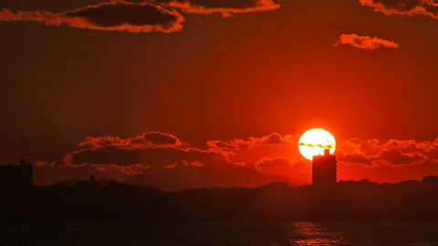 The Sunset Beyond the Townscape Stock Footage 327540398