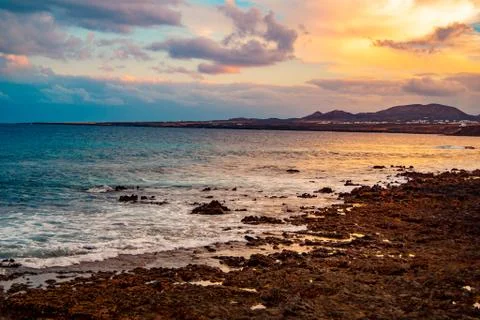 Sunset with big clouds from the beach Foto stock