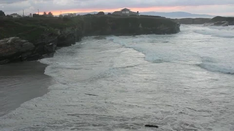 Sunset with big waves in Os Castros beach, Ribadeo, Spain Stock Footage 303671087