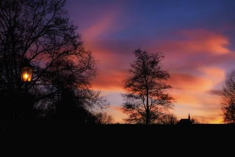 Sunset with black silhouette and dramatic sky Stock Photos
