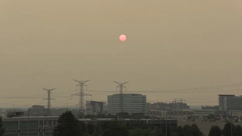 Sunset blocked by wildfire and forest fire smoke in the sky Stock Footage 157612756