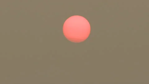 Sunset blocked by wildfire and forest fire smoke in the sky Stock Footage 157612783