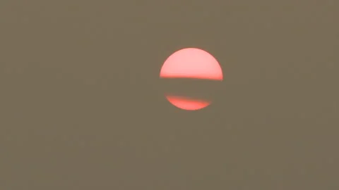 Sunset blocked by wildfire and forest fire smoke in the sky Stock Footage 157613084