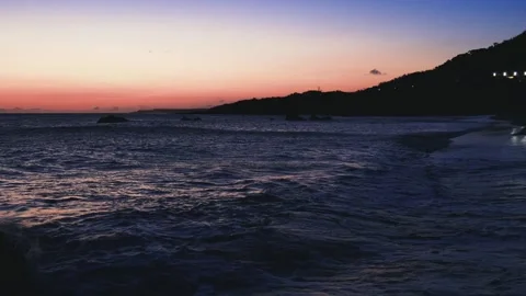 At sunset blue hour in arc Bay beach, the continuous rolling wave. Stock Footage 280132042