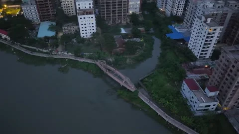 Sunset Blue Hour Drone View of Lakeside Residential Cityscape in Bangladesh 動画素材 344695821