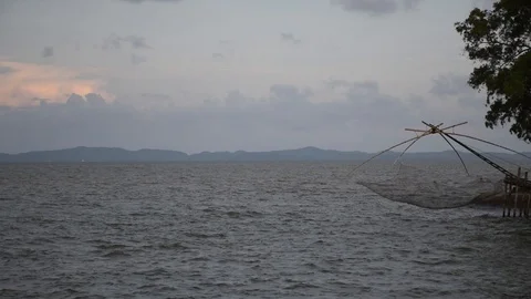 Sunset blue orange sky and tool fisherman in south Thailand Stock Footage 129249173