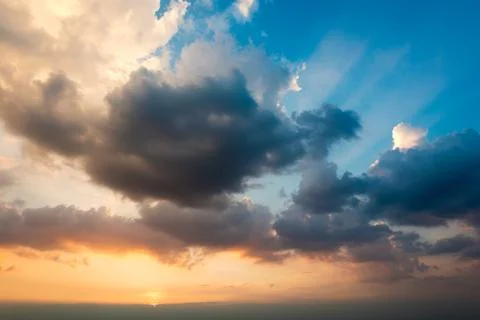 Sunset with blue sky and clouds Stock Photos
