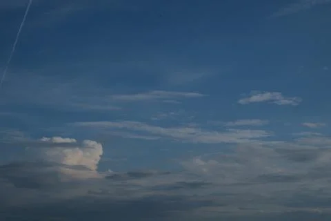 Sunset on blue sky. Blue sky with some clouds. blue sky clouds, summer skies Stock Photos