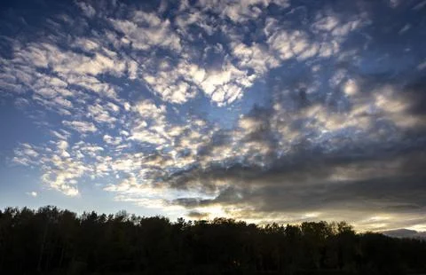Sunset on blue sky. Blue sky with some clouds. blue sky clouds, summer skies, Stock Photos