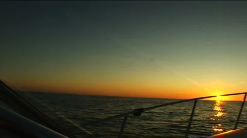 Sunset on boat in Atlantic Ocean Stock Footage 888772