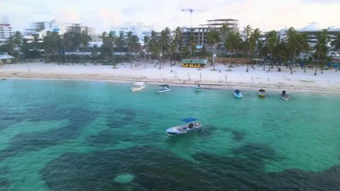 Sunset boat over turquoise beach in San Andres Stock Footage 331255254